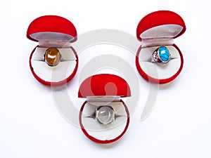 Opened round red jewelry boxes isolated on white background