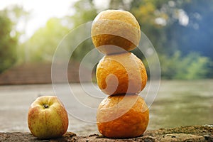 Three orange and apple with blur