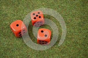 Three orange dice