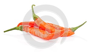 Three orange hot chili pepper isolated on white background