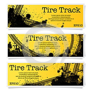 Three orange tire track banners