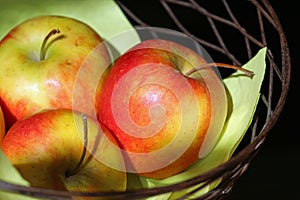 Organic apples in basket close-up