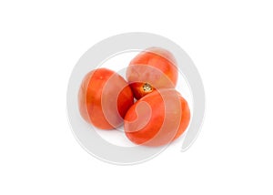 Three organic ripe tomatoes on an isolated white background