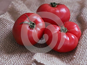 Three organic tomatoes