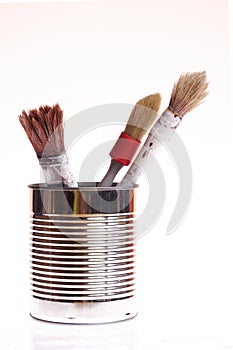 Three paint brushes in a can