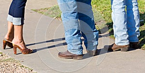 Three pair of boots and jeans