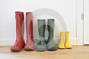 Three pairs of colorful wellingtons