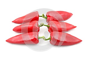 Three pairs of red sweet pepper on white background