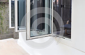 Three panel aluminium casement window stay on white wall