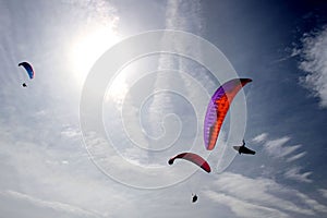 Three parachutes in the sky