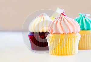 Three Pastel color Cup cake muffins