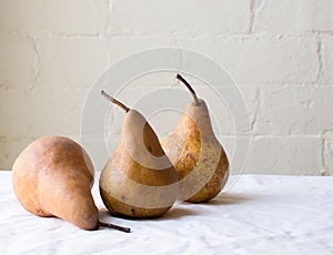 Three pears on table