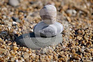 Three pebble stones stacked one over another