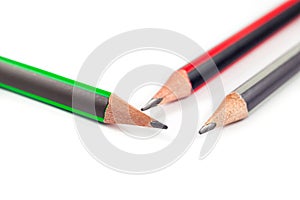 Three pencils on a white background