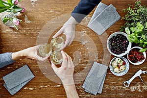 Three people toasting with wine