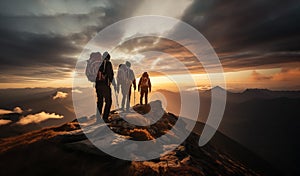 Three people on the top of the mountain during golden hour