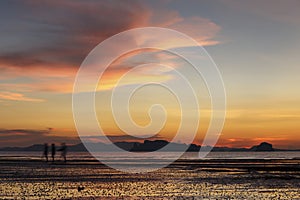 People walking in the sunset at Ao Nang Beach, Krabi, Thailand