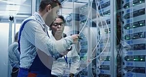 Three people working in a data center