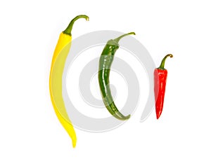 Three peppers in a row in different colors