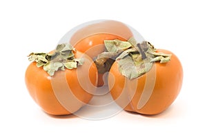 Three persimmons isolated on white background