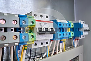 The three-phase circuit breaker is installed in the same row with the connection terminals in the electrical Cabinet