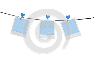 Blue photoframes with blue heart clothepins photo
