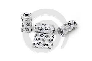 Three-piece disposable pets dog waste poop roll pochette and cute black-white paw printing.