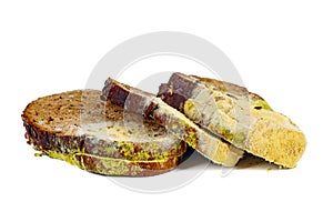 Three piece of rye bread with mold isolated on white