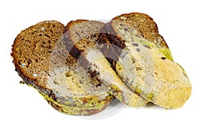 Three piece of rye bread with mold isolated on white