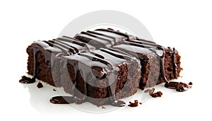 Three pieces of chocolate cake with chocolate drizzle