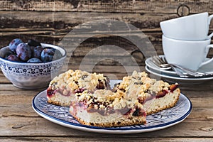 Three pieces of plum cake with crumble photo
