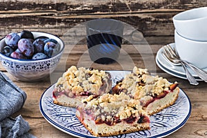 Three pieces of plum cake with crumble photo