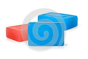 Three pieces of red and blue toilet soap on a white background. Full depth of field.