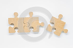 Three pieces of wooden puzzle on white background