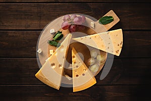 Three pieces of yellow swiss cheese with holes