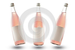 Three pink bottles on a white background with empty labels, mockup. soda or lemonade, isolate