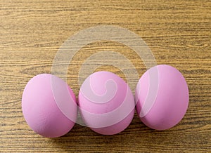 Three Pink Century Egg on Wooden Table