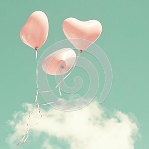 Three Pink Heart-shaped balloons