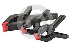 Three plastic clamps on a white background