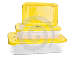 Three plastic containers for food storage. rectangular shape. with a yellow cap.