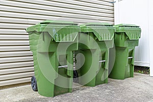 Three Plastic Trash Containers