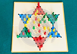 Three-player gameboard of Diamond Game on table