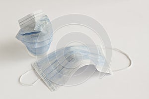 Three ply structure,single use hygenic face mask on white photo