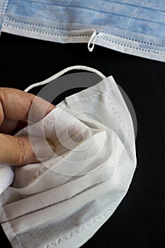Three ply structure,single use hygenic,surgical,face mask with deformable wire on black background with without wire mask photo