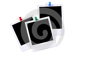 Three polaroid photo prints with pushpins isolated white background