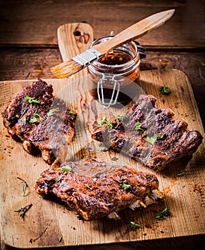 Three portions of spicy grilled ribs photo