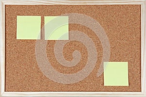 Three post-it notes sticked on corkboard