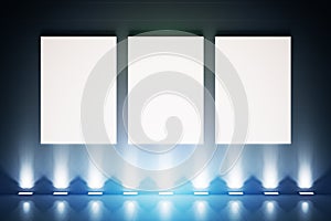 Three posters with blue light