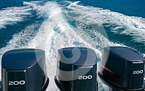 Three powerful engines for 200 hp on a speedboat.