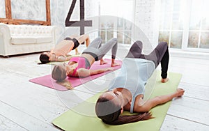 Three pretty girls enjoying group training